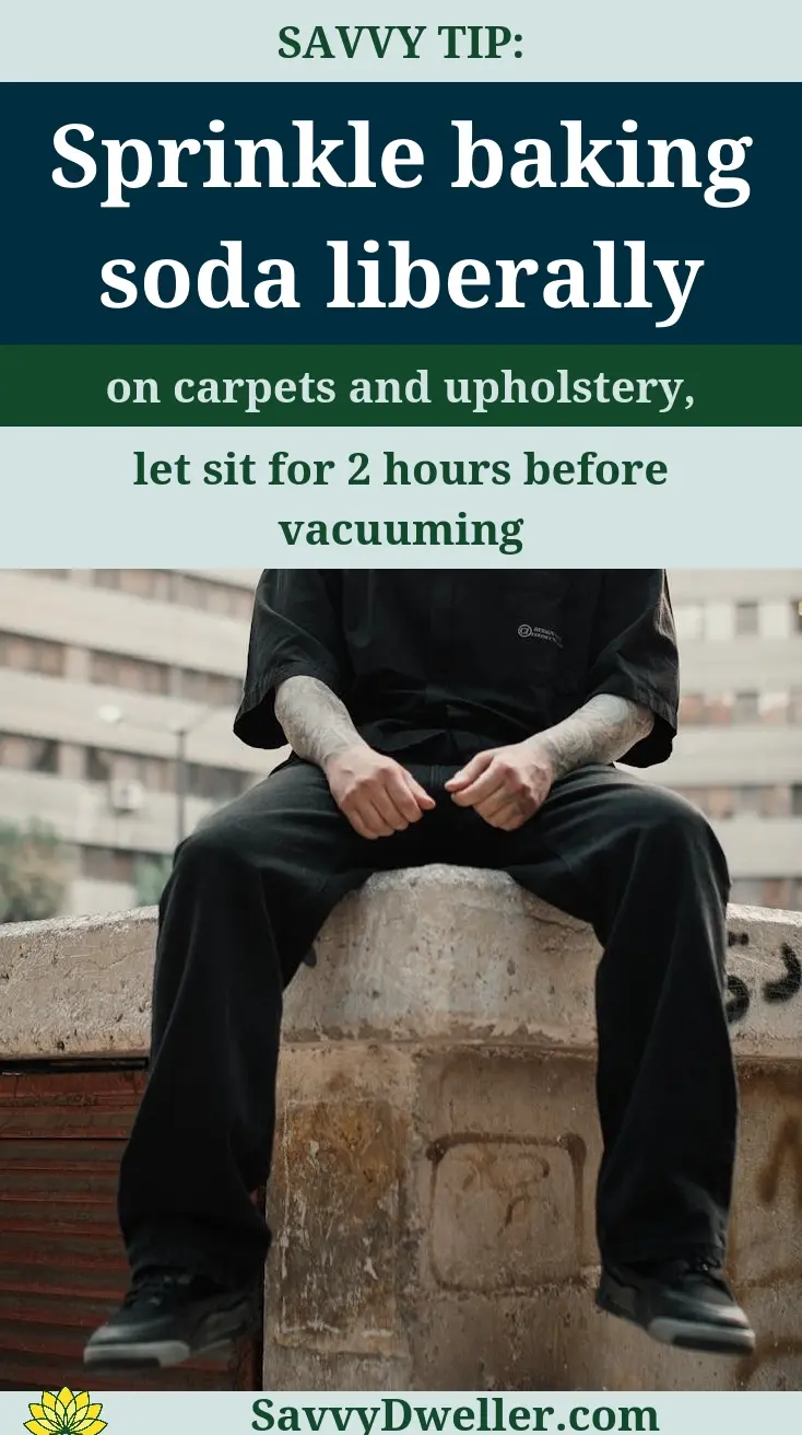 Person sprinkling baking soda on carpets to remove cigarette smoke smell