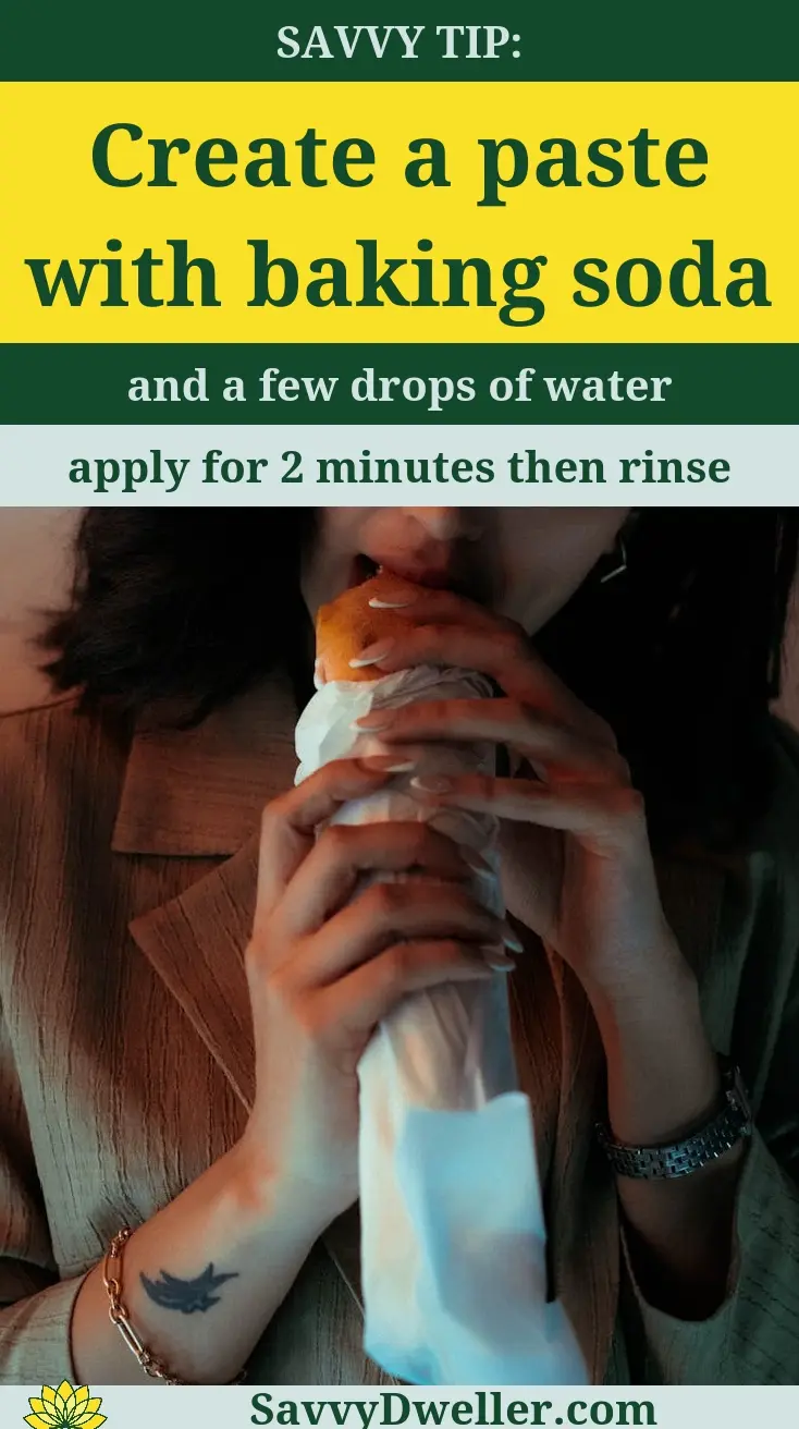 Person applying a baking soda paste mixture to a canker sore for quick relief overnight.