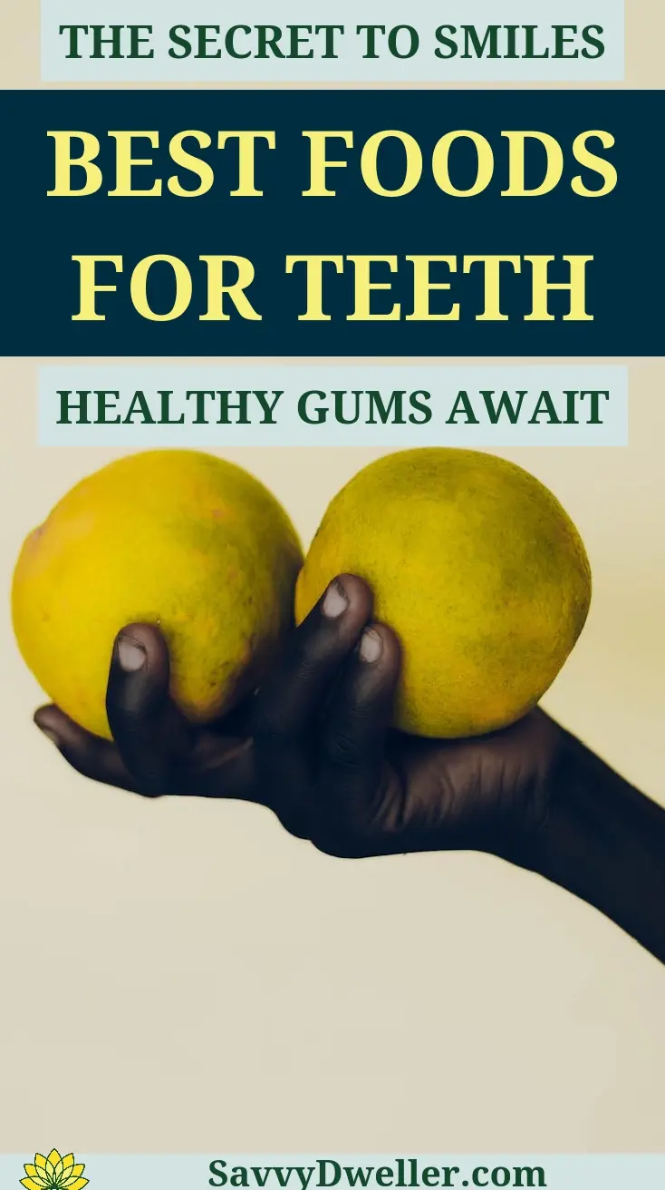 A hand holding two lemons representing the best foods for healthy teeth and gums.