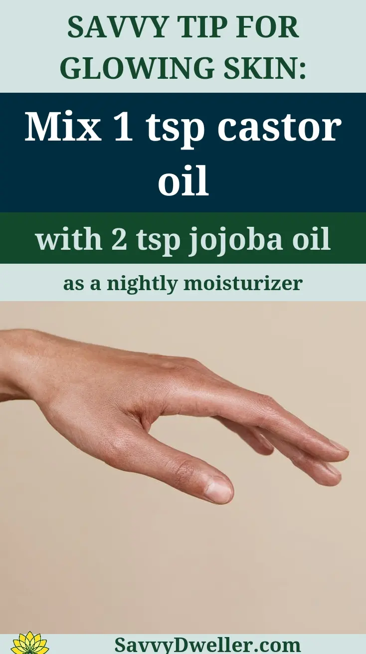 Hand applying castor oil and jojoba oil mixture for skin benefits