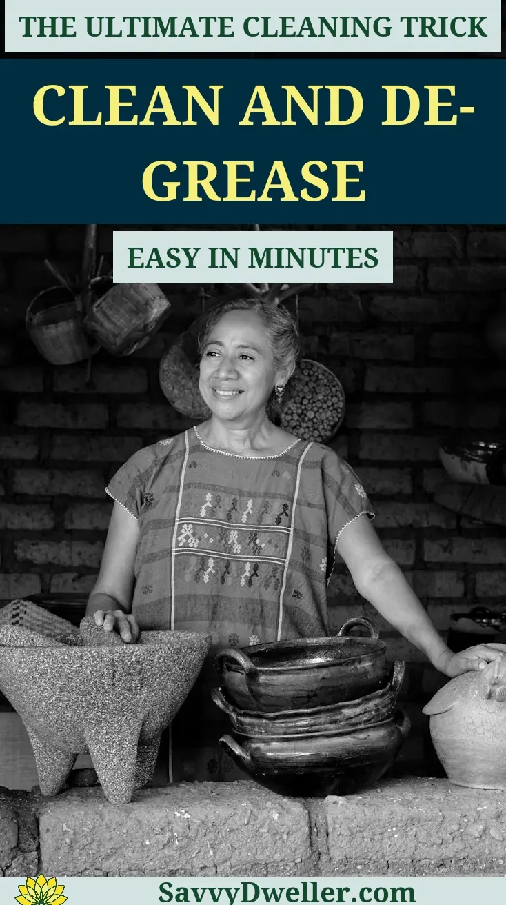A woman demonstrating an effective method to clean and degrease kitchen cabinets.