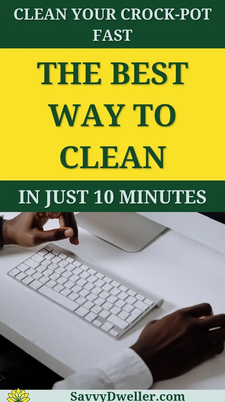 A hand cleaning a Crock-Pot using effective methods.