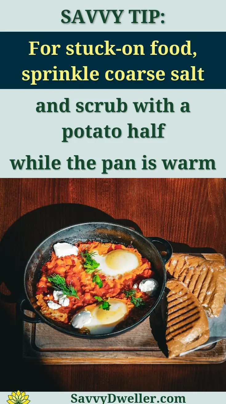 Two servings of shakshuka with toasted bread on wooden boards, captured at a Kyiv restaurant.