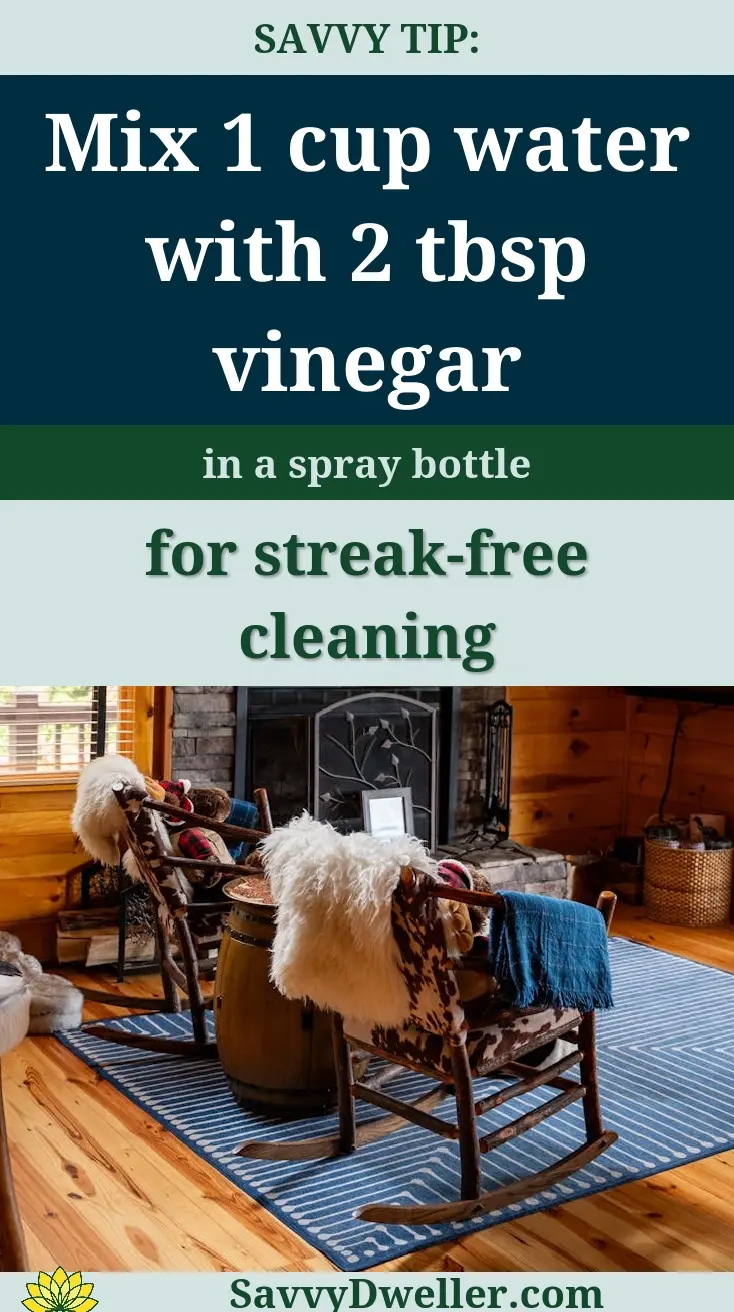 Mixing water and vinegar in a spray bottle for cleaning ceiling fans without making a mess