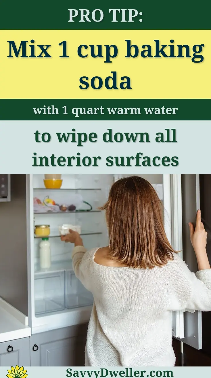 A woman reaches into a refrigerator in a contemporary kitchen, creating a lifestyle moment.