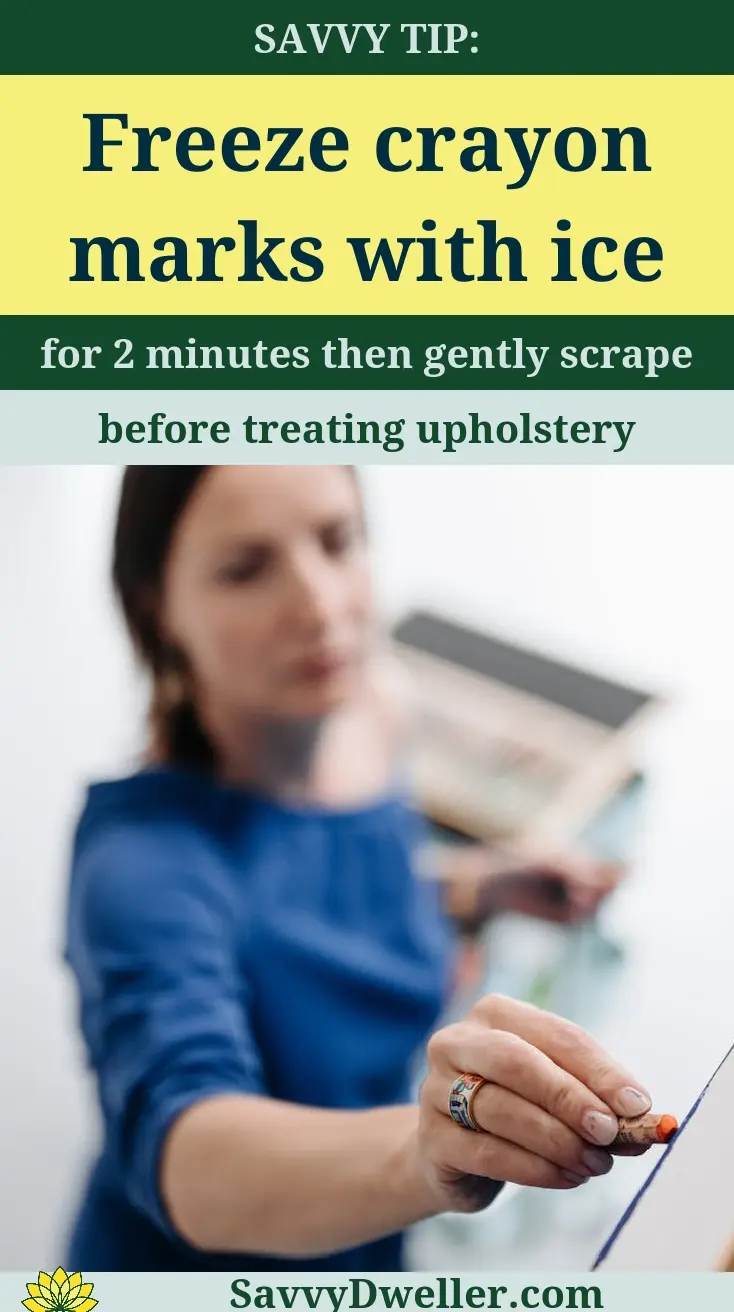 A parent removing crayon marks with ice from walls and furniture