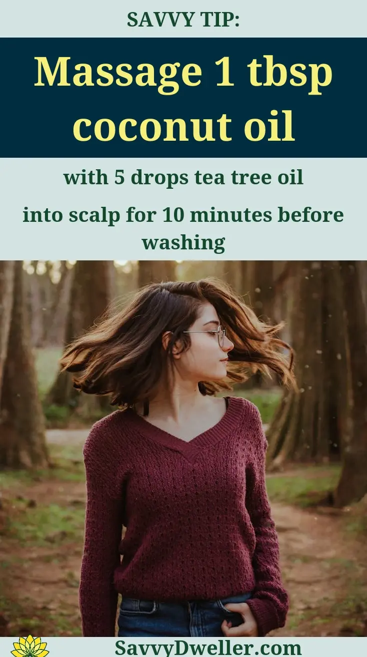 Woman applying coconut oil on scalp to treat dandruff naturally