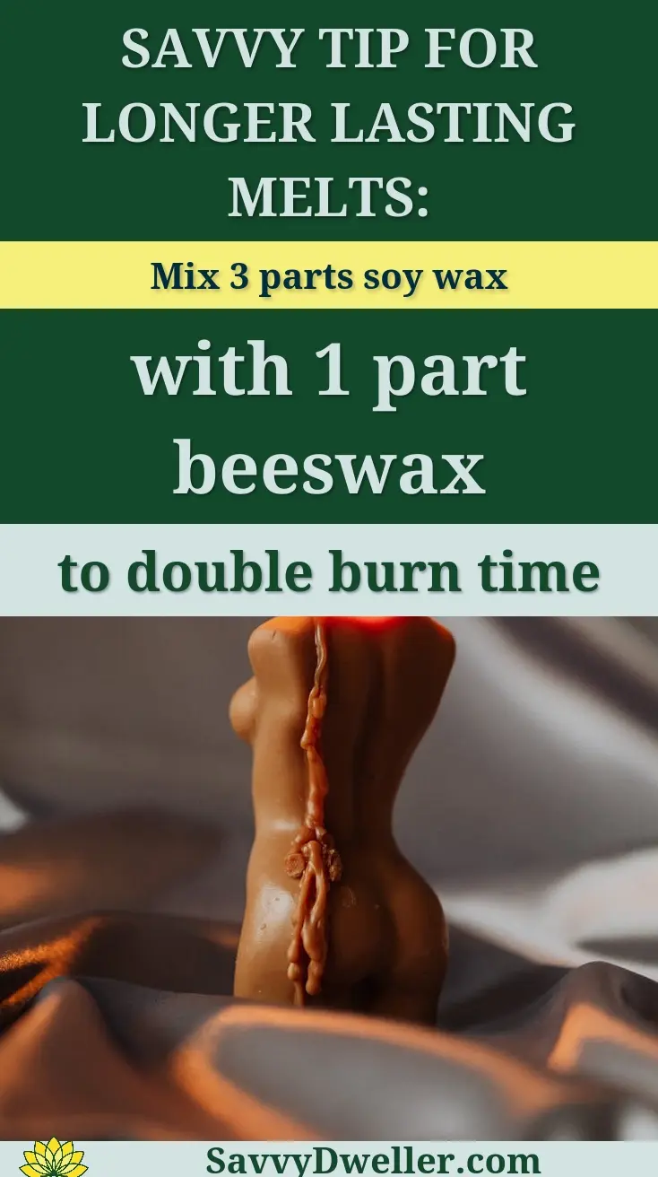 Elegant torso-shaped candle with flame on silk fabric, perfect for tranquil and romantic settings.