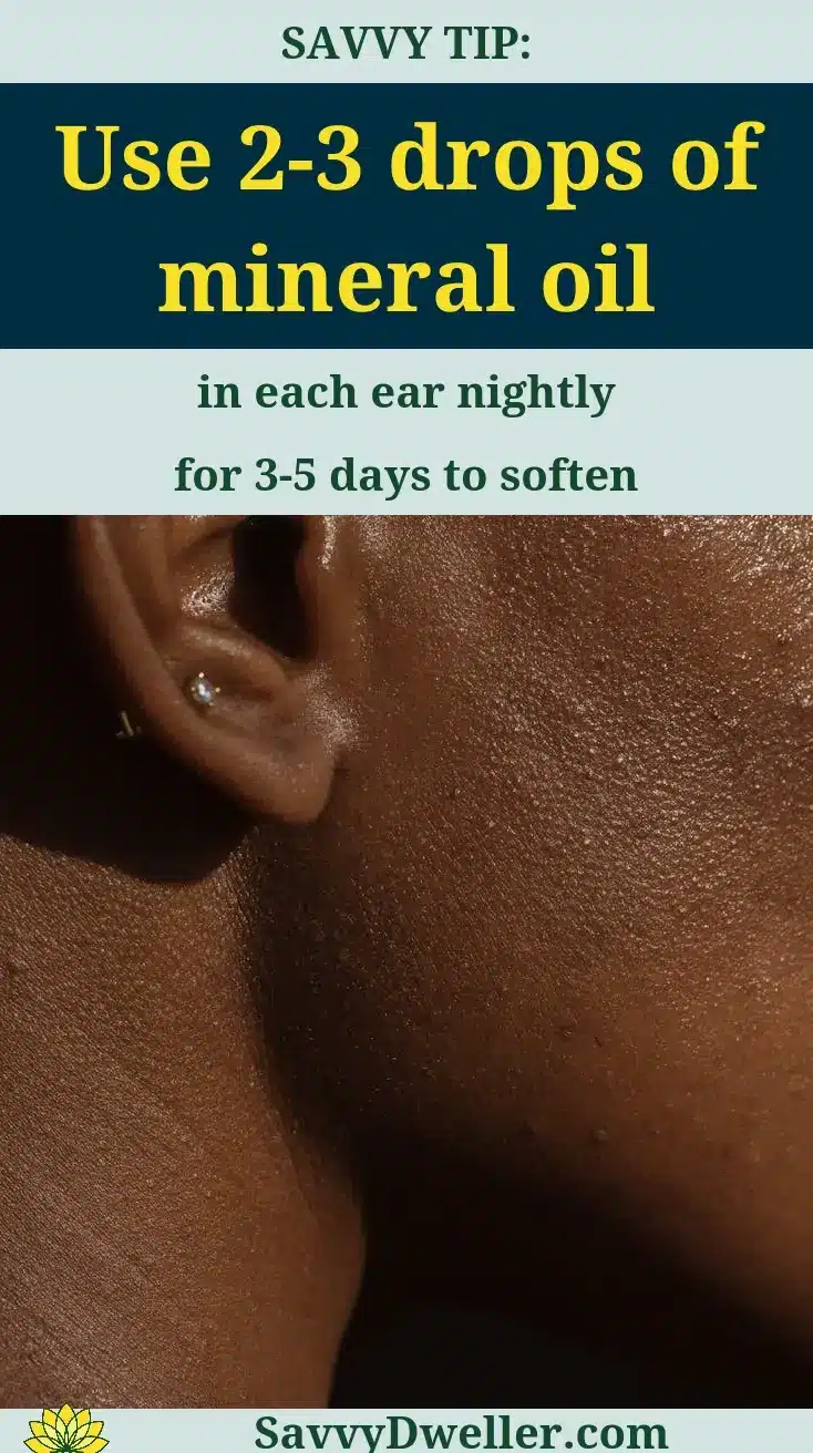 A close-up image of an ear with a tip for using mineral oil to safely remove ear wax
