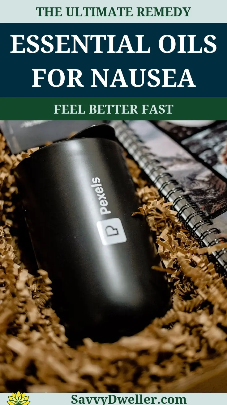 A black essential oil container amidst shredded paper, related to remedies for nausea.