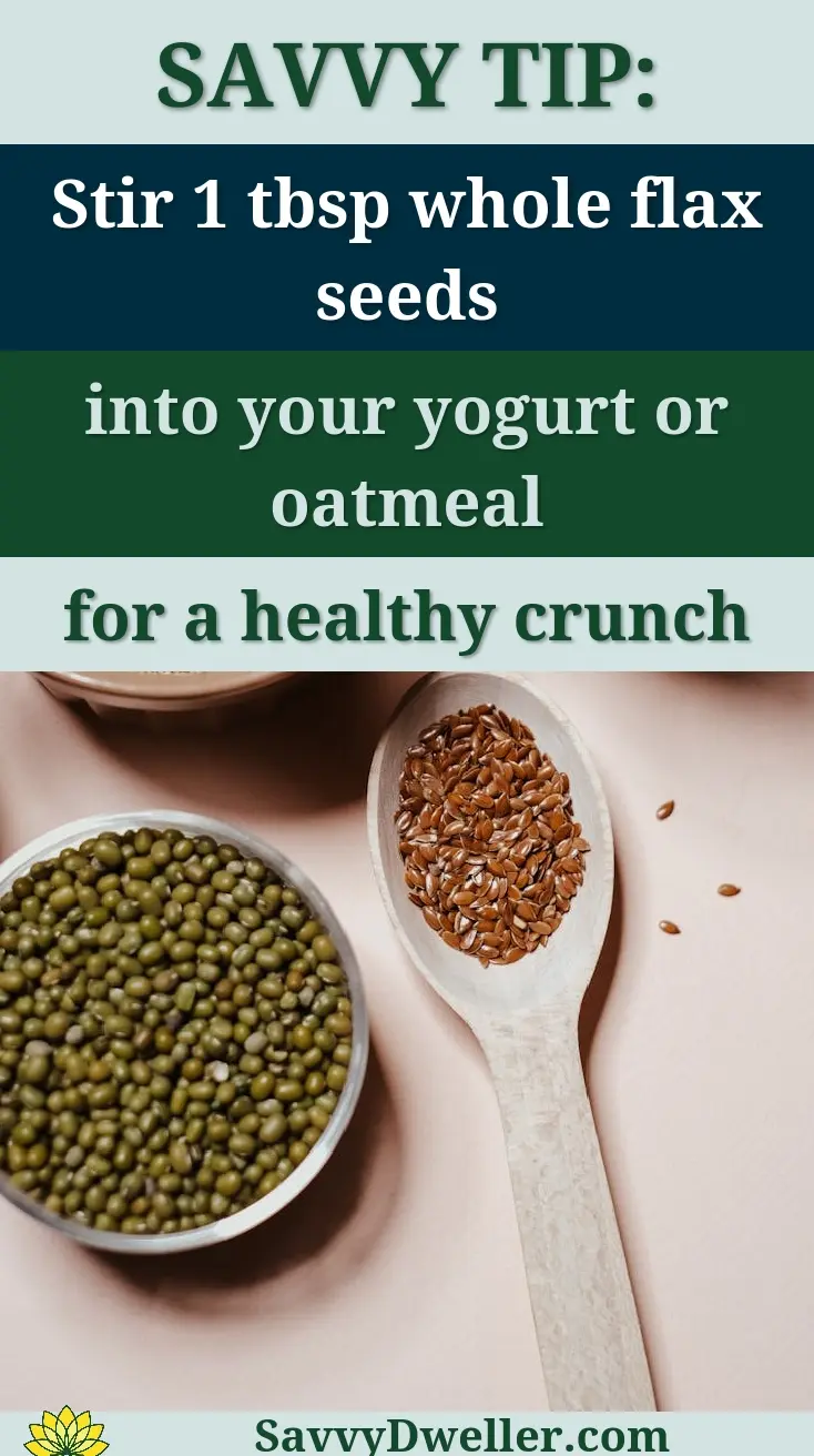 Bowl of whole flax seeds and spoon showcasing how to add flax seeds to your diet