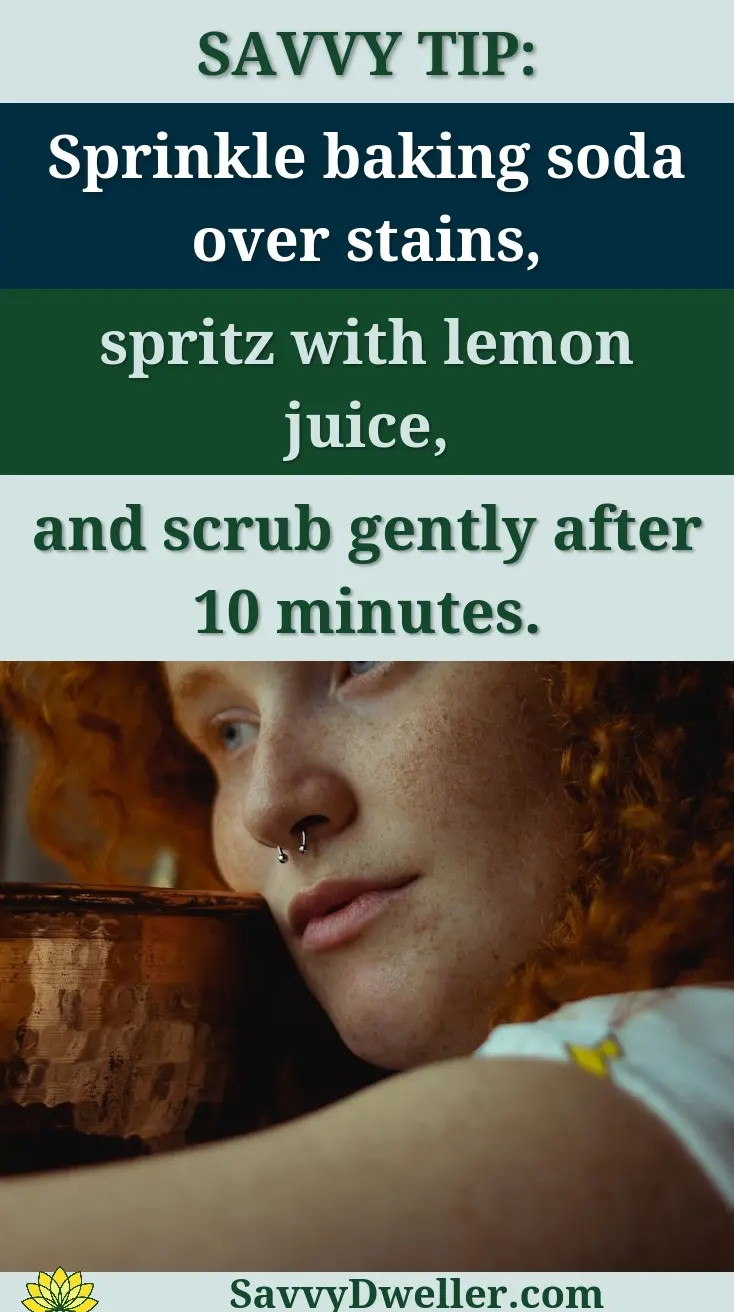 A tip for removing hard water stains from a stainless steel sink using baking soda and lemon juice.