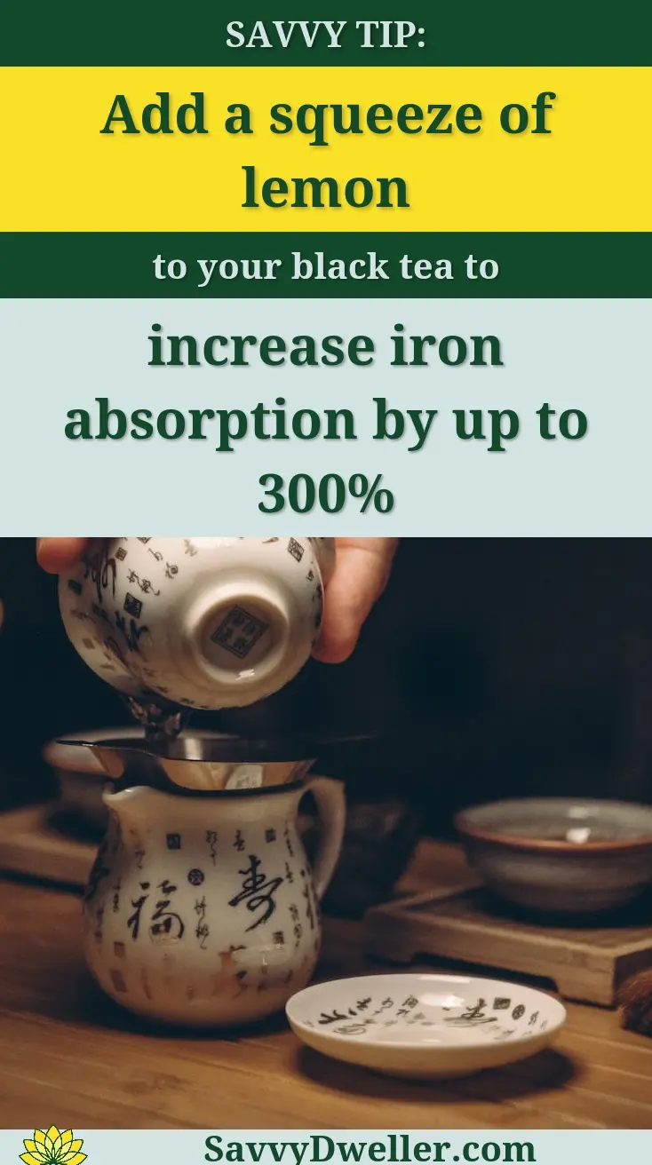 A person adding lemon to black tea to enhance iron absorption, related to health benefits of tea.