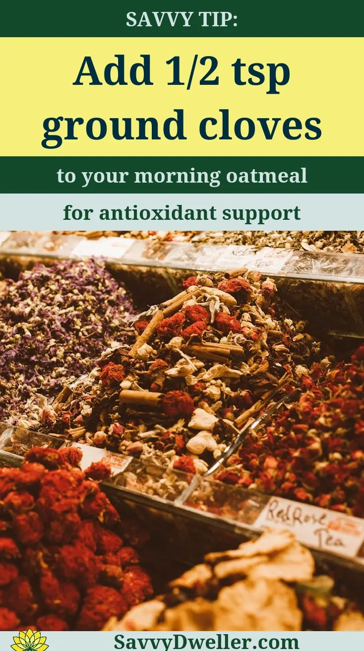 A variety of spices including ground cloves, highlighting their health benefits.