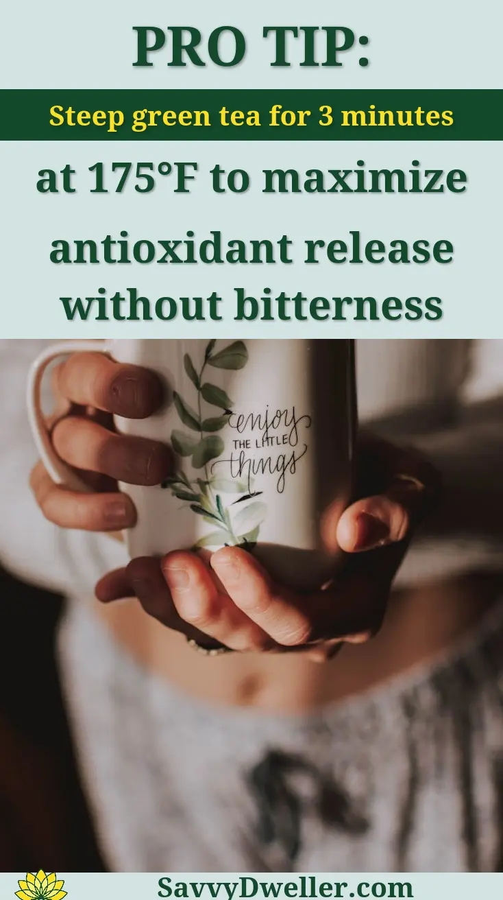 Person holding a cup of green tea with a pro tip on steeping for maximum health benefits