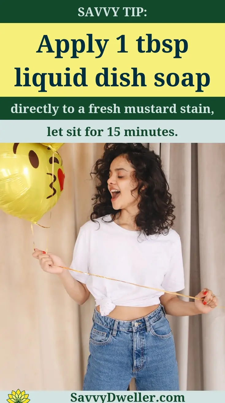 Woman holding a balloon while applying dish soap for removing ketchup and mustard stains from white shirts