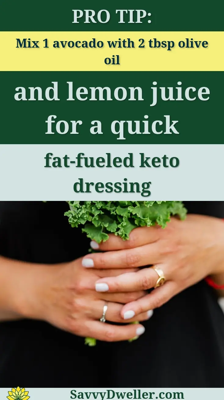 Close-up of woman holding fresh kale in her hands against a white background.