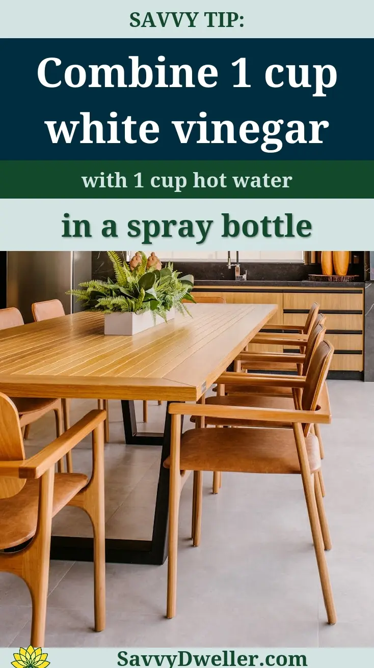 Mix of vinegar and hot water in a spray bottle for cleaning kitchen cabinets