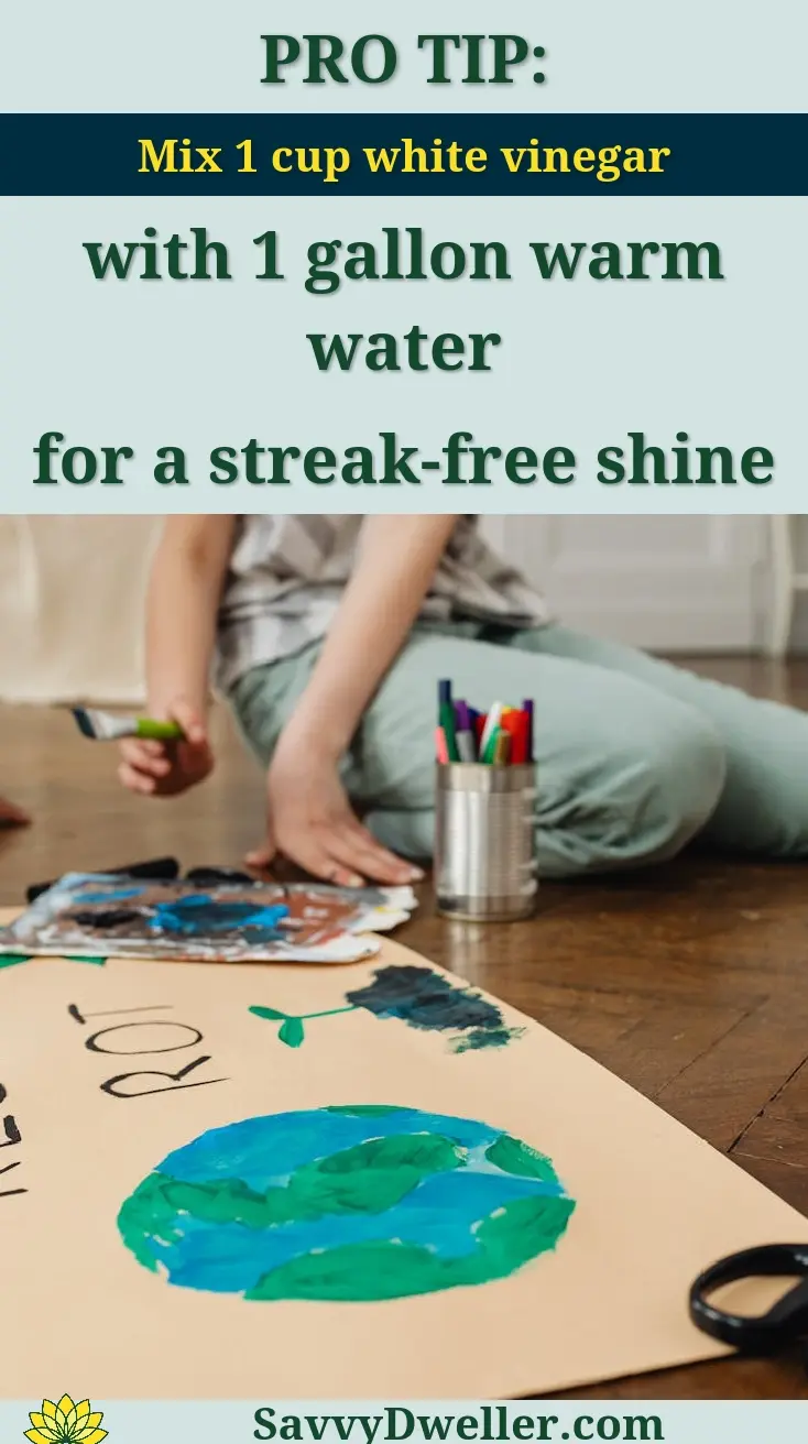 Teenage girl working on a recycling-themed art project indoors, emphasizing environmental awareness.