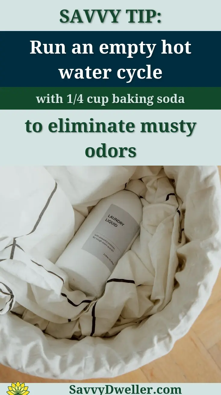 Overhead view of a laundry basket filled with cloths and a detergent bottle on wooden floor.