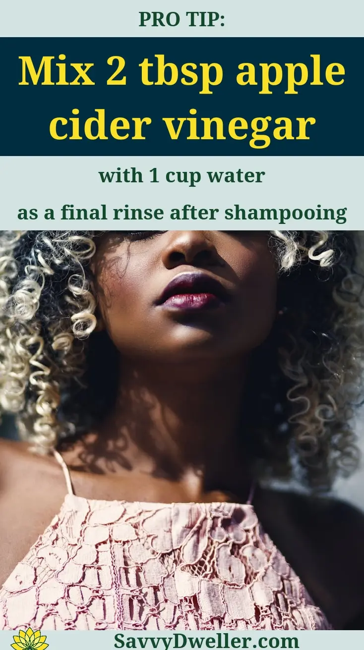Woman with curly hair suggesting apple cider vinegar for dandruff treatment