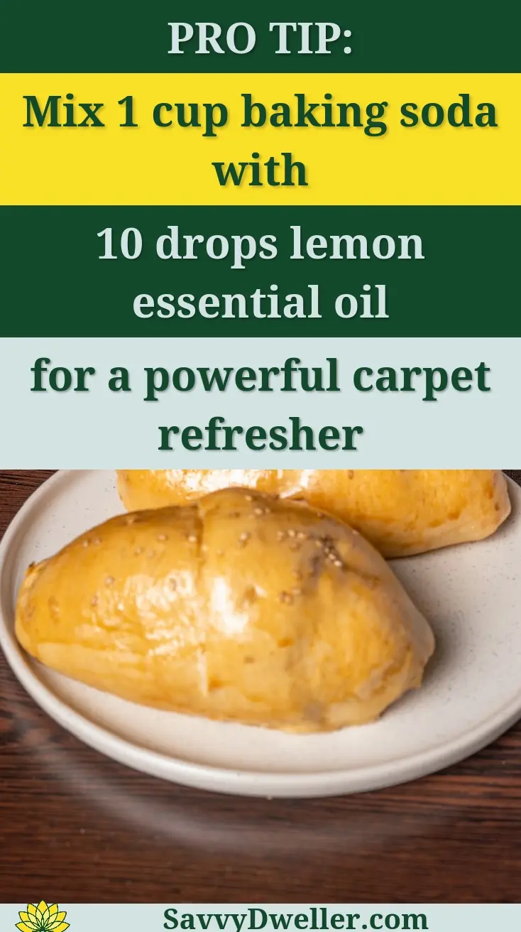A plate of freshly baked buns served with a can of malt beverage on a wooden table.
