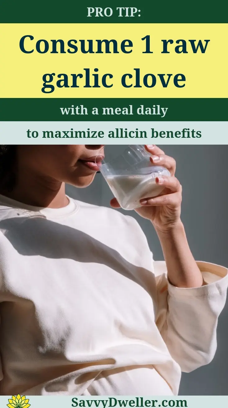 Person drinking a beverage after consuming raw garlic clove for H. Pylori remedy