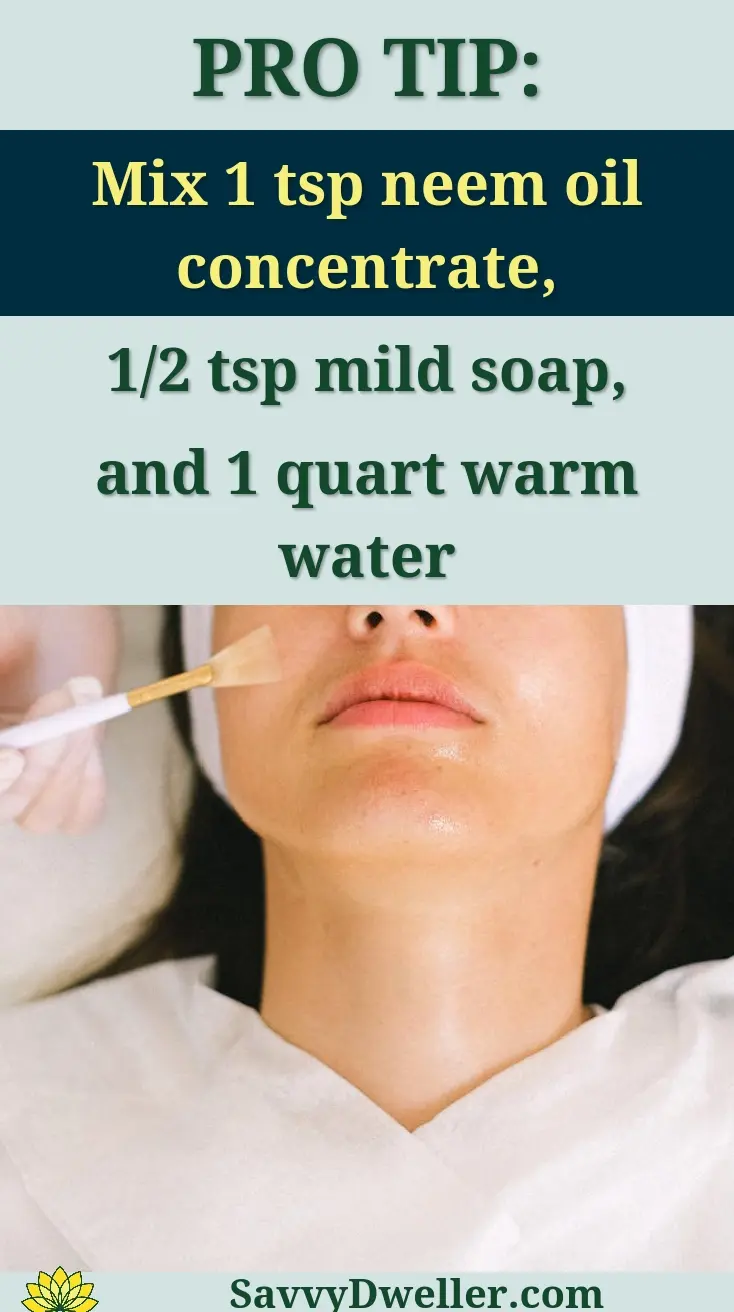 Top view skilled female cosmetologist in uniform and gloves applying essential oil on young woman face skin while working in contemporary spa center