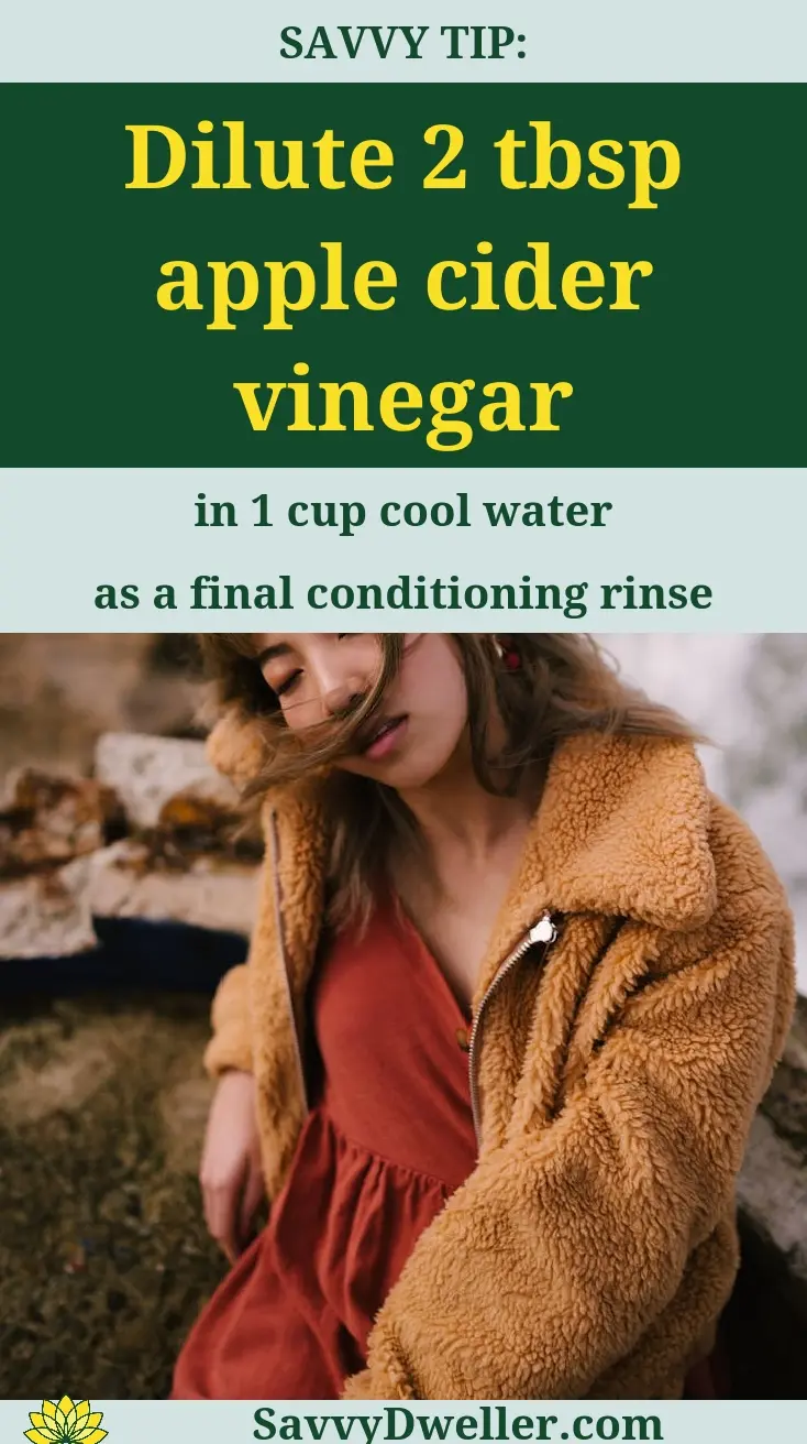 Woman demonstrating no-poo method with apple cider vinegar rinse in hair care
