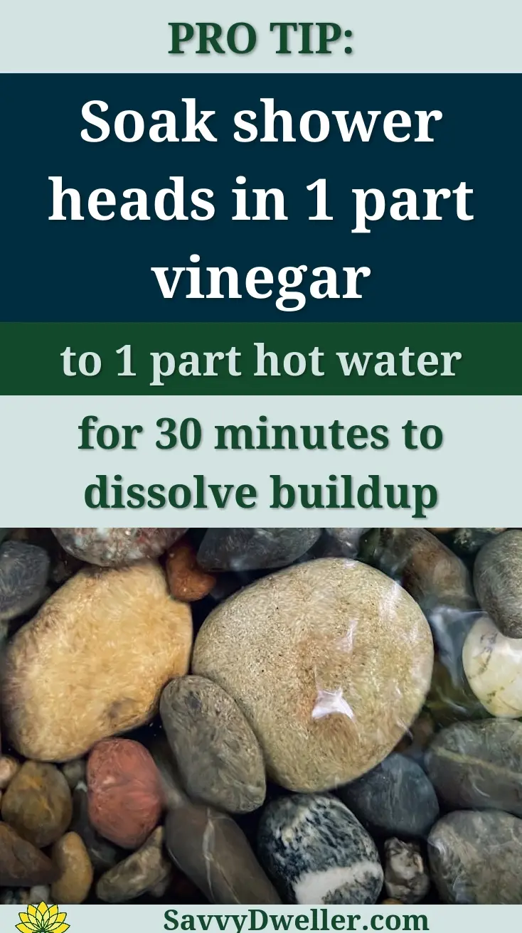 A heart-shaped amethyst crystal atop melting ice against a dark background.