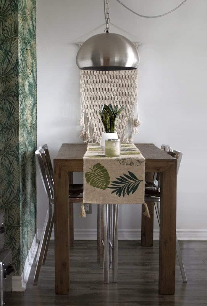 services-03 Modern dining setup with wood table, metal chairs, and tropical decor for a stylish interior feel.