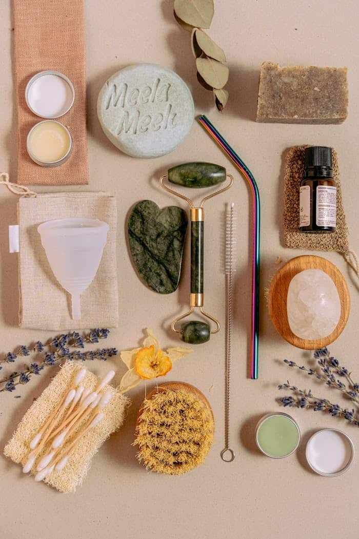 hero-contact Flat lay of eco-friendly skincare and hygiene essentials with natural tools and products.