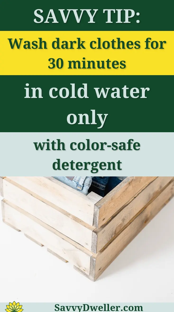 Multiple denim jeans neatly folded inside a rustic wooden crate on a white background.