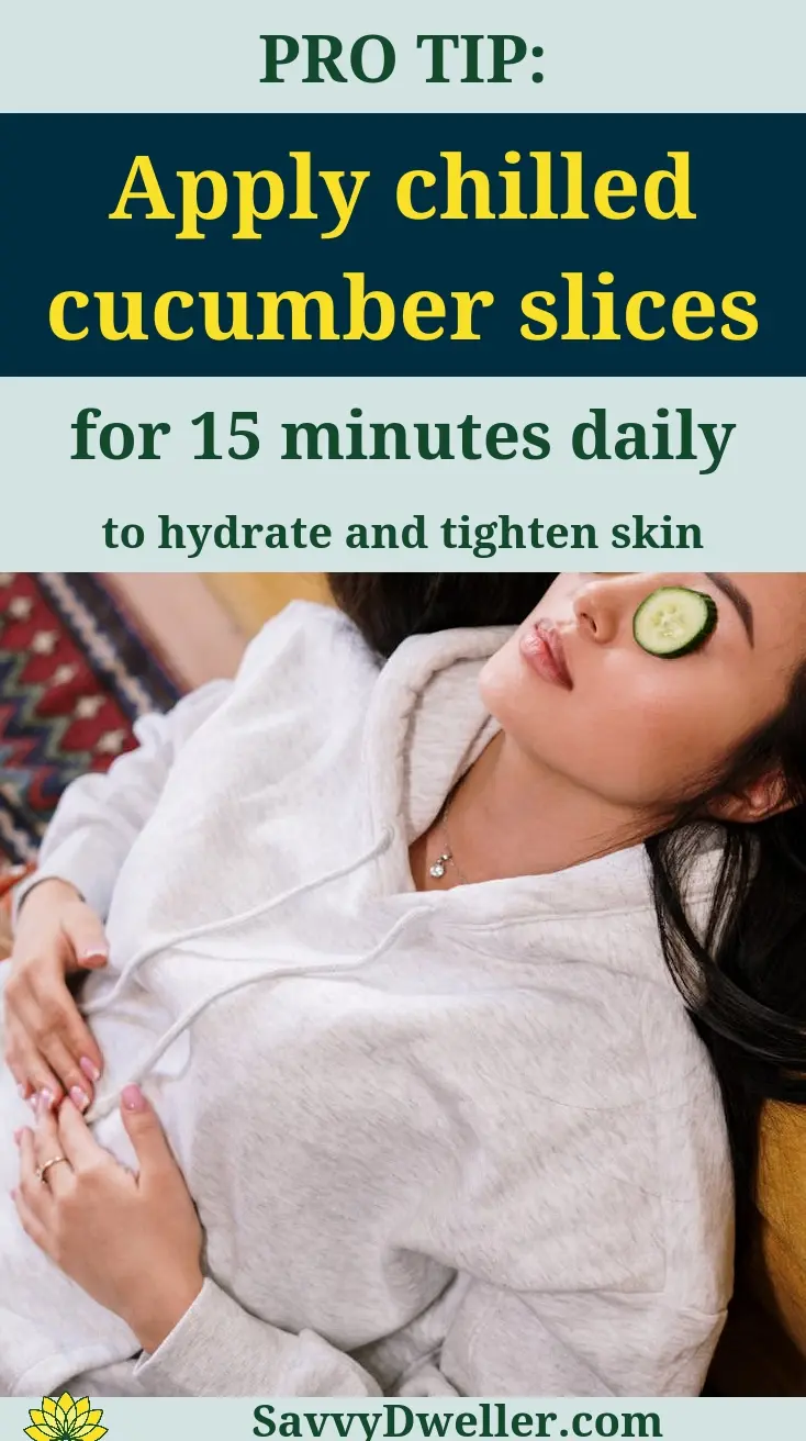 Woman applying chilled cucumber slices under her eyes for natural wrinkle reduction.