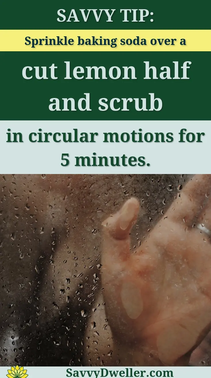A woman's hand against a glass shower door with water droplets, creating a blurred effect.