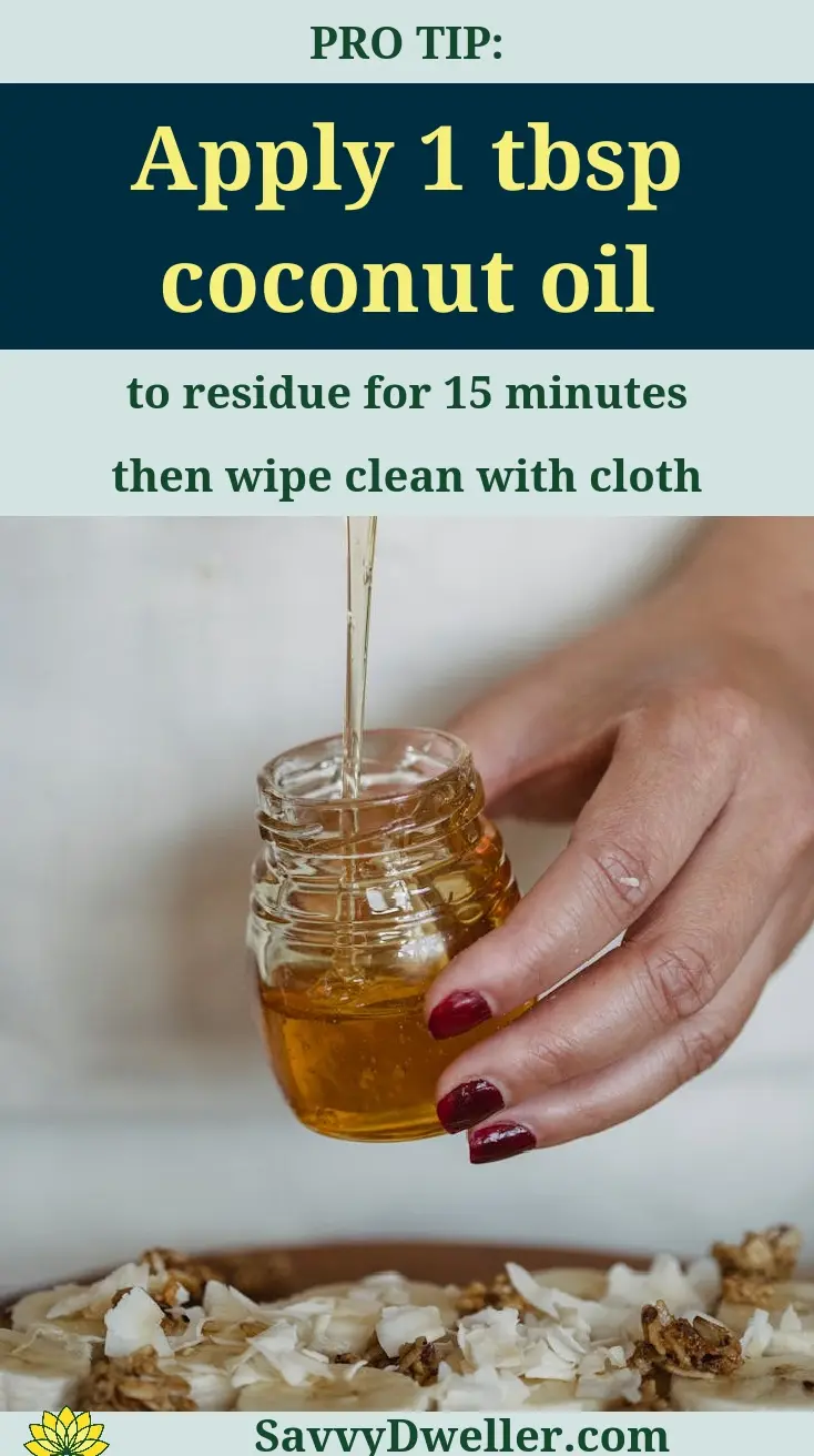 Applying coconut oil to remove sticky residue from surfaces