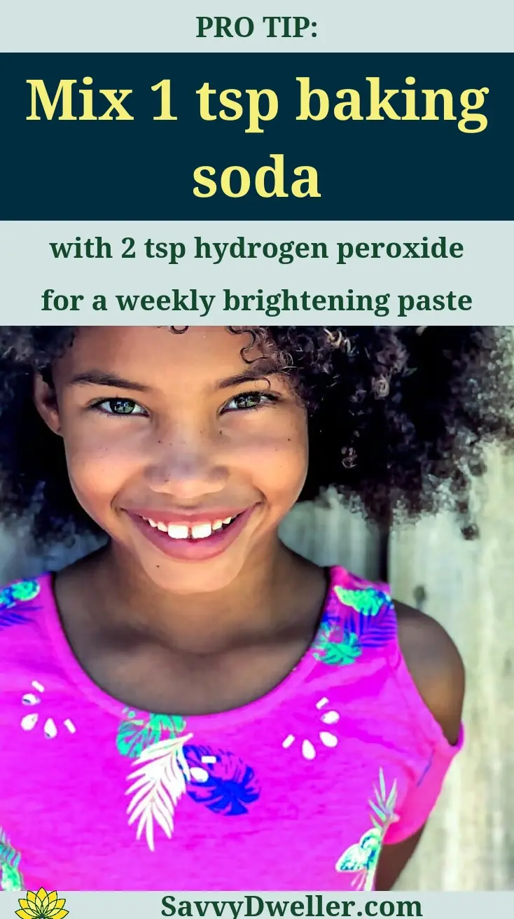 Smiling girl showing teeth whitening results using baking soda and hydrogen peroxide.