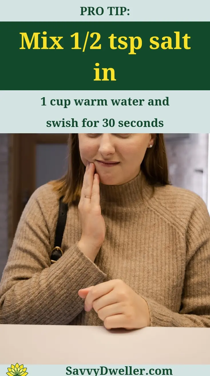 Woman holding her jaw in pain, using saltwater remedy for toothache relief