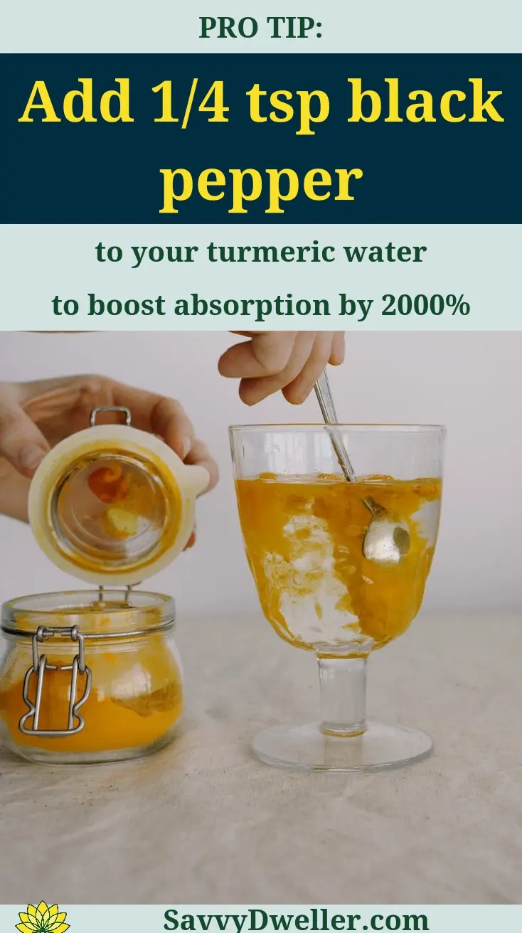 A person preparing turmeric water with added black pepper for health benefits