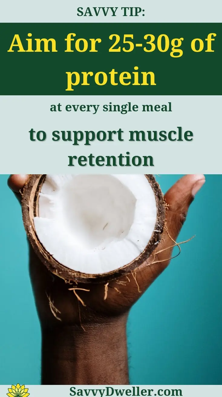 Hand holding coconut suggesting protein intake for weight loss after 40