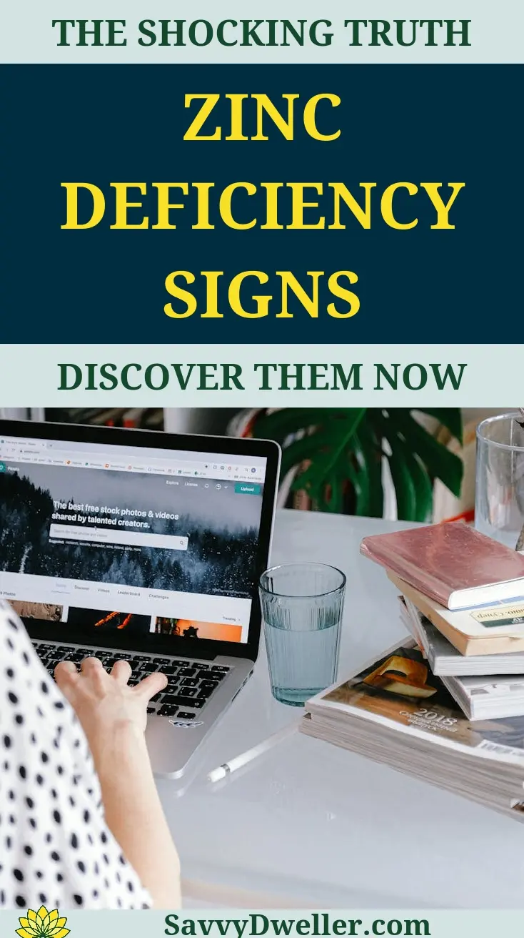A laptop displaying information about zinc deficiency signs with books and water glasses in the background.